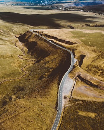 Aerial Photo of Road Surrounded by Field