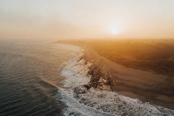 aerial photo of sea under gray sky