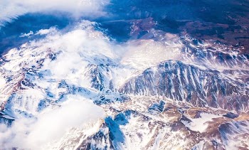 aerial photo of snow covered mountains
