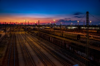 Aerial Photo of Train Rails Under Golden Sky