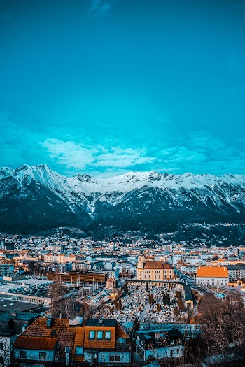 Aerial Photo Of Village Beside Mountain