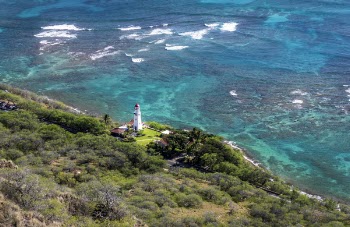 Aerial Photo of White Lighthouse Near Beach and Trees