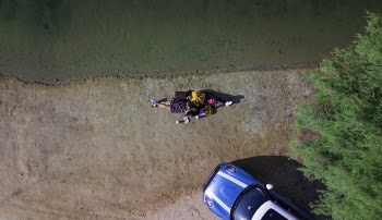 Aerial Photo of Women Lying on Ground