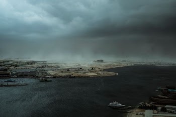 aerial photo on sea port with gloomy clouds