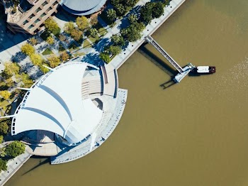 aerial photograph of a building near body of water