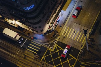 aerial photograph of an vehicles on street at night