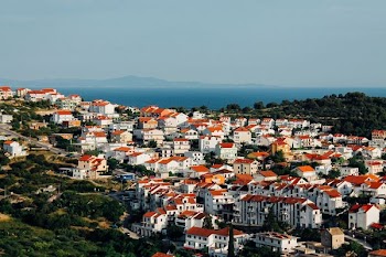 aerial photograph of red-and-white concrete highrise buildings