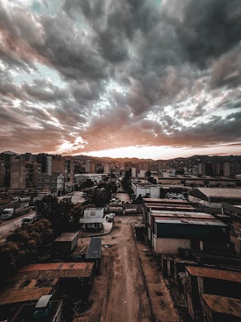 Aerial Photography If Cityscape Under Dramatic Sky