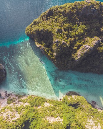 Aerial Photography of an Island Surrounded by Blue Sea