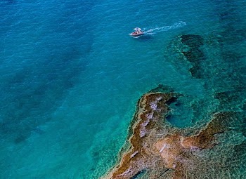 aerial photography of boat on body of water