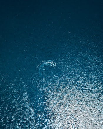 Aerial Photography of Boat on Body of Water