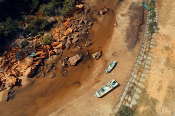 Aerial Photography of Boat on Sand