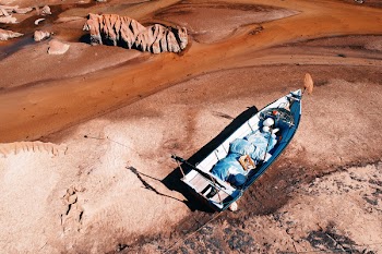 Aerial Photography of Boat on Shoreline