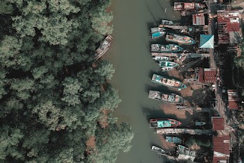 Aerial Photography of Boats Near Body of Water