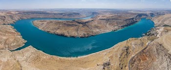 aerial photography of bodies of water and mountain