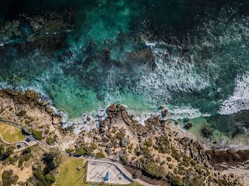 aerial photography of body of water beside island