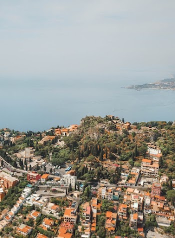 Aerial Photography of Buildings and Body of Water
