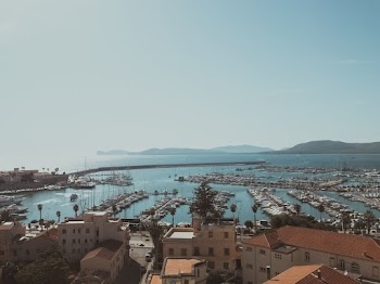 Aerial Photography of Buildings Beside Body of Water