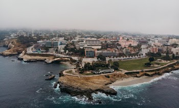 Aerial Photography of Buildings Beside of Sea