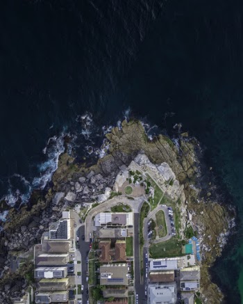 Aerial Photography of Buildings Beside Sea