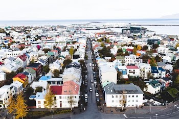 aerial photography of buildings near body of water