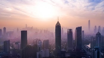 Aerial Photography of City Buildings Under Cloudy Sky