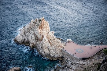aerial photography of cliff on body of water