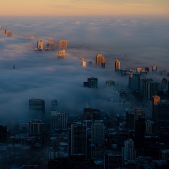 Aerial Photography Of Clouds Covering Buildings