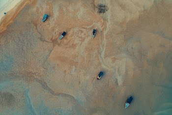 Aerial Photography of Five Boats on Sea