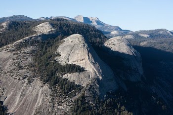 aerial photography of folding mountain with trees at daytime