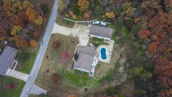 Aerial Photography of Gray House Near Forest and Road