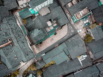 aerial photography of gray roofed houses