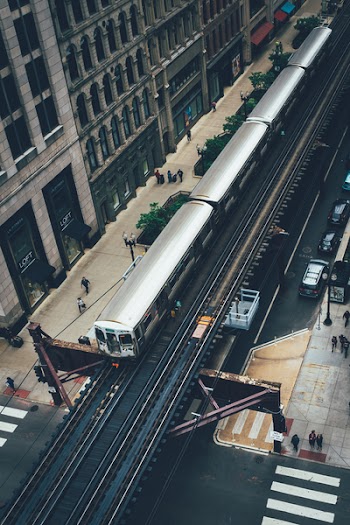 Aerial Photography of Gray Train Near Building