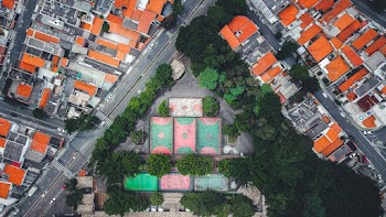Aerial Photography of Green and Orange Concrete Houses