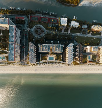 Aerial Photography of High-rise Tower Near the Body of Water