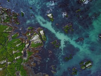 aerial photography of island surrounded by water during daytime