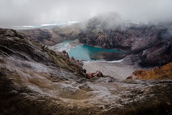 aerial photography of lake covered with fogs
