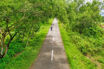 Aerial Photography Of Man Riding Motorcycle Along Road