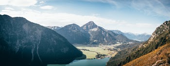 Aerial Photography of Mountain and Body of Water