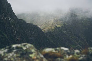 aerial photography of mountain and clouds view during daytime
