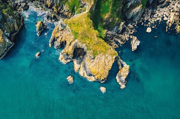 Aerial Photography of Mountain Near Water 