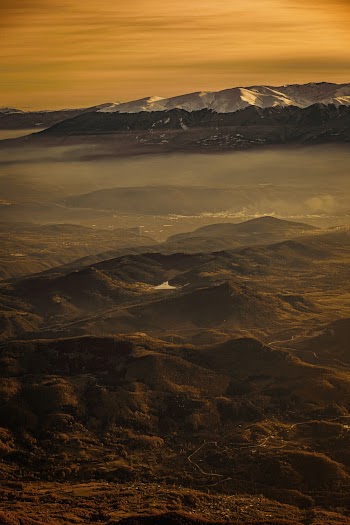 Aerial Photography of Mountain Under Orange Sky