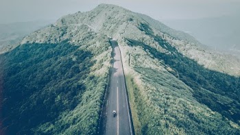 aerial photography of mountain with road
