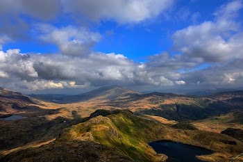 aerial photography of mountains near lake at daytime