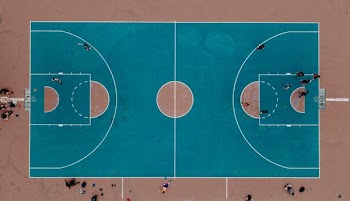 aerial photography of people playing basketball on court