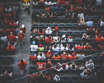 aerial photography of people sitting on gang chair