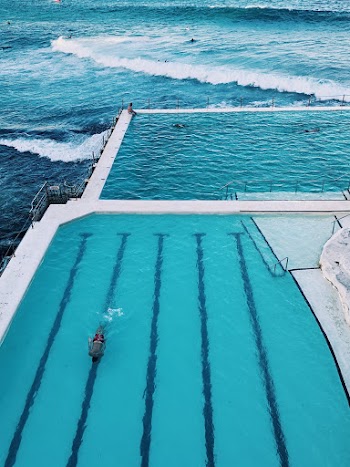 Aerial Photography of Pool and Body of Water
