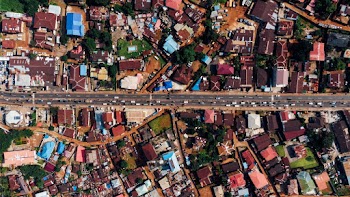 Aerial Photography of Road Between Houses