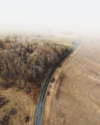 Aerial Photography of Road Near Brown Field
