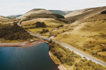 Aerial Photography of Roadway and Body of Water